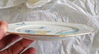 Assiette porcelaine dessert octogonale vintage décoration papillon 3 revisité par créatrice artistique dans atelier Français